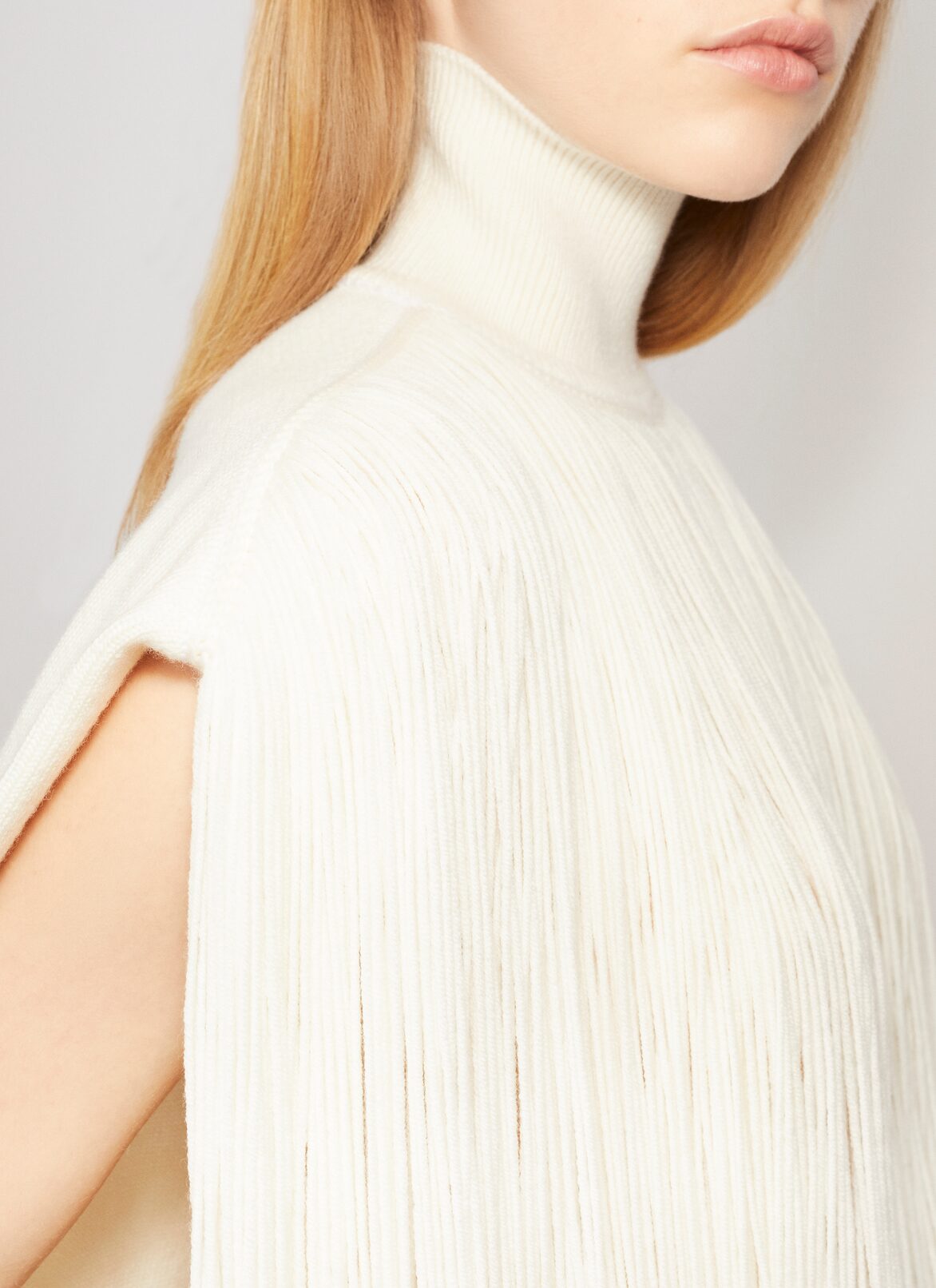 KNITTED FRINGES JUMPER ALAÏA OFF-WHITE KNITTED FRINGES JUMPER